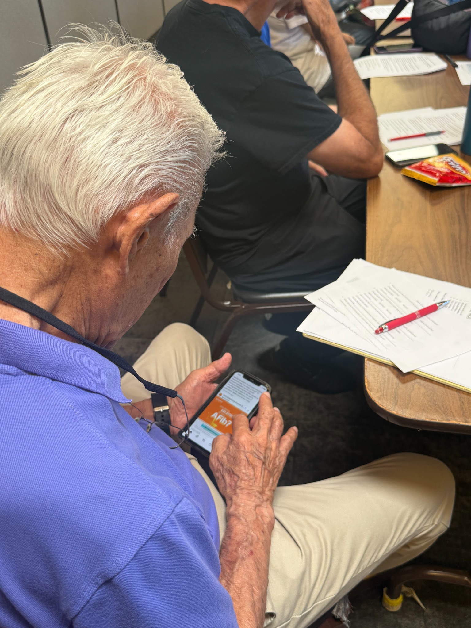 Senior practicing phone skills